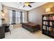 Cozy bedroom features a bed, and a built-in bookshelf at 9378 Longstone Dr, Parker, CO 80134