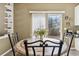 Cozy breakfast nook with a mosaic table, seating for four, and natural light streaming in at 9378 Longstone Dr, Parker, CO 80134