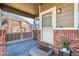 Cozy front porch with brick accents and a welcoming entrance at 9378 Longstone Dr, Parker, CO 80134
