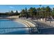 Community pool featuring many lounge chairs, tables, and pool shade structures at 9378 Longstone Dr, Parker, CO 80134