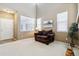 Inviting room with a comfortable chair, bright windows, and neutral tones at 9378 Longstone Dr, Parker, CO 80134