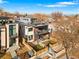Stunning aerial view of the modern home with a rooftop deck and a fenced front yard at 1845 W 33Rd Ave, Denver, CO 80211