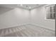 Spacious basement with carpet, a window well, and recessed lighting provides a clean and functional additional space at 1845 W 33Rd Ave, Denver, CO 80211