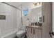 Well-lit bathroom with a shower-tub combination, modern fixtures, and a stylish vanity for a contemporary feel at 1845 W 33Rd Ave, Denver, CO 80211