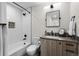 Well-lit bathroom with shower/tub combo and modern vanity at 1845 W 33Rd Ave, Denver, CO 80211