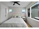 Bright bedroom with a comfortable bed, a side table, and a large window that offers great natural light at 1845 W 33Rd Ave, Denver, CO 80211