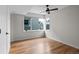 Bright bedroom featuring hardwood floors and large windows at 1845 W 33Rd Ave, Denver, CO 80211