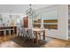 Elegant dining area featuring a wooden table, seating for six, and an open concept kitchen at 1845 W 33Rd Ave, Denver, CO 80211