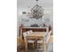 Stylish kitchen with a center island, modern lighting, and an adjacent dining area at 1845 W 33Rd Ave, Denver, CO 80211