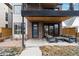 Modern home with a brick facade and a patio area with stylish outdoor seating at 1845 W 33Rd Ave, Denver, CO 80211