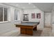 Basement game room features a ping pong table, neutral decor, and ample lighting for recreational activities at 1845 W 33Rd Ave, Denver, CO 80211