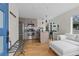 An open kitchen featuring stainless steel appliances, a breakfast bar, and access to a relaxing couch at 1845 W 33Rd Ave, Denver, CO 80211