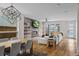 Open-concept living area with a modern fireplace, hardwood floors, and sliding glass doors at 1845 W 33Rd Ave, Denver, CO 80211