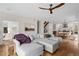 Cozy living room with hardwood floors, a sectional sofa, and an open layout to the dining area at 1845 W 33Rd Ave, Denver, CO 80211