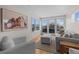 Inviting living area with comfortable seating, a neutral color palette, and access to a balcony with city vistas at 1845 W 33Rd Ave, Denver, CO 80211