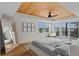 Spacious main bedroom with a wood ceiling, ceiling fan, city view, and natural light at 1845 W 33Rd Ave, Denver, CO 80211