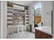 Mudroom featuring custom built-ins, hooks, and shelving, and access to a private backyard at 1845 W 33Rd Ave, Denver, CO 80211