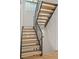 Modern staircase with open treads, steel railings, and plenty of natural light at 1845 W 33Rd Ave, Denver, CO 80211