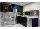Basement wet bar features stainless steel appliances, custom cabinetry, and an eye-catching backsplash at 1845 W 33Rd Ave, Denver, CO 80211