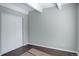 This bedroom offers hardwood floors and a closet with sliding doors at 9995 E Harvard Ave # 155, Denver, CO 80231