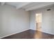 This bedroom features hardwood floors, a ceiling beam, and an ensuite bathroom at 9995 E Harvard Ave # 155, Denver, CO 80231