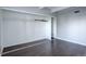 This bedroom offers hardwood floors, a closet, and track lighting at 9995 E Harvard Ave # 155, Denver, CO 80231