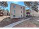 Multi-story condo building with balconies and patios, surrounded by mature trees, offering a blend of comfort and nature at 9995 E Harvard Ave # 155, Denver, CO 80231