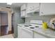 Bright kitchen featuring stainless steel refrigerator and granite countertops at 9995 E Harvard Ave # 155, Denver, CO 80231