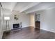 Spacious living room featuring decorative fireplace and bar area at 9995 E Harvard Ave # 155, Denver, CO 80231