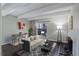 Cozy living room with beamed ceiling, dining area, and sliding glass doors to outdoor patio at 9995 E Harvard Ave # 155, Denver, CO 80231
