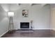 Living room showing fireplace with decoratively tiled hearth and modern floor lamp at 9995 E Harvard Ave # 155, Denver, CO 80231