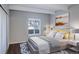 Sun-filled main bedroom with large windows, soft carpeting, and white ceiling beams at 9995 E Harvard Ave # 155, Denver, CO 80231
