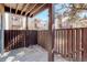 Relaxing outdoor patio area with wood privacy fence, blending indoor comfort with outdoor serenity at 9995 E Harvard Ave # 155, Denver, CO 80231