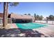 Exterior view of the clubhouse and swimming pool with a closed cover for the winter at 9995 E Harvard Ave # 155, Denver, CO 80231