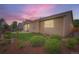 Charming backyard featuring a patio, lush lawn, and beautiful landscaping with a privacy fence at 5394 S Valdai Way, Aurora, CO 80015
