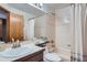 Classic bathroom with a shower-tub combo, neutral tile, and a functional vanity at 5394 S Valdai Way, Aurora, CO 80015