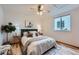 Cozy bedroom features a ceiling fan and bright window for comfortable and well-lit space at 5394 S Valdai Way, Aurora, CO 80015