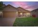 Charming single-Gathering home with a manicured lawn, covered porch, and brick accents on the garage and entrance at 5394 S Valdai Way, Aurora, CO 80015