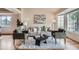 Cozy living room featuring neutral decor, stylish seating, and hardwood floors, creating an inviting space at 5394 S Valdai Way, Aurora, CO 80015