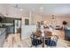 Open-concept living space combines dining area, kitchen with modern appliances, and stylish living area at 5394 S Valdai Way, Aurora, CO 80015