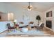 Inviting living room featuring a fireplace, hardwood floors, vaulted ceilings, and comfortable seating at 5394 S Valdai Way, Aurora, CO 80015