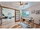 Bright home office with hardwood floors, a ceiling fan, and lots of natural light overlooking the front yard at 5394 S Valdai Way, Aurora, CO 80015