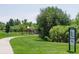 Pioneer Park's scenic walking path amidst lush greenery and play areas at 5394 S Valdai Way, Aurora, CO 80015