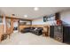 Cozy basement area with a lounge and vintage radio, offering a relaxed space for entertainment and leisure at 860 Zenobia St, Denver, CO 80204