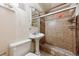 Bathroom with a pedestal sink and glass shower with tiled walls, offering a functional and clean space at 860 Zenobia St, Denver, CO 80204