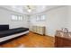Bedroom featuring beautiful hardwood floors, bright natural light, and a bed at 860 Zenobia St, Denver, CO 80204