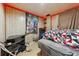 Intimate bedroom with unique red lighting and paneled walls, offering a private space to relax and unwind at 860 Zenobia St, Denver, CO 80204