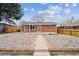 Beautiful exterior showcasing the walkway to the house and stone landscaping at 860 Zenobia St, Denver, CO 80204