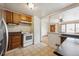 Functional kitchen with appliances and view into living area at 860 Zenobia St, Denver, CO 80204