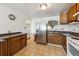 Kitchen featuring stainless steel refrigerator and wooden cabinets at 860 Zenobia St, Denver, CO 80204